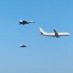 Indian Navy P-8I Poseidon aircraft in formation with MiG-29K fighter jets