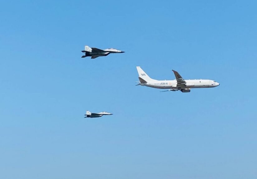 Indian Navy P-8I Poseidon aircraft in formation with MiG-29K fighter jets