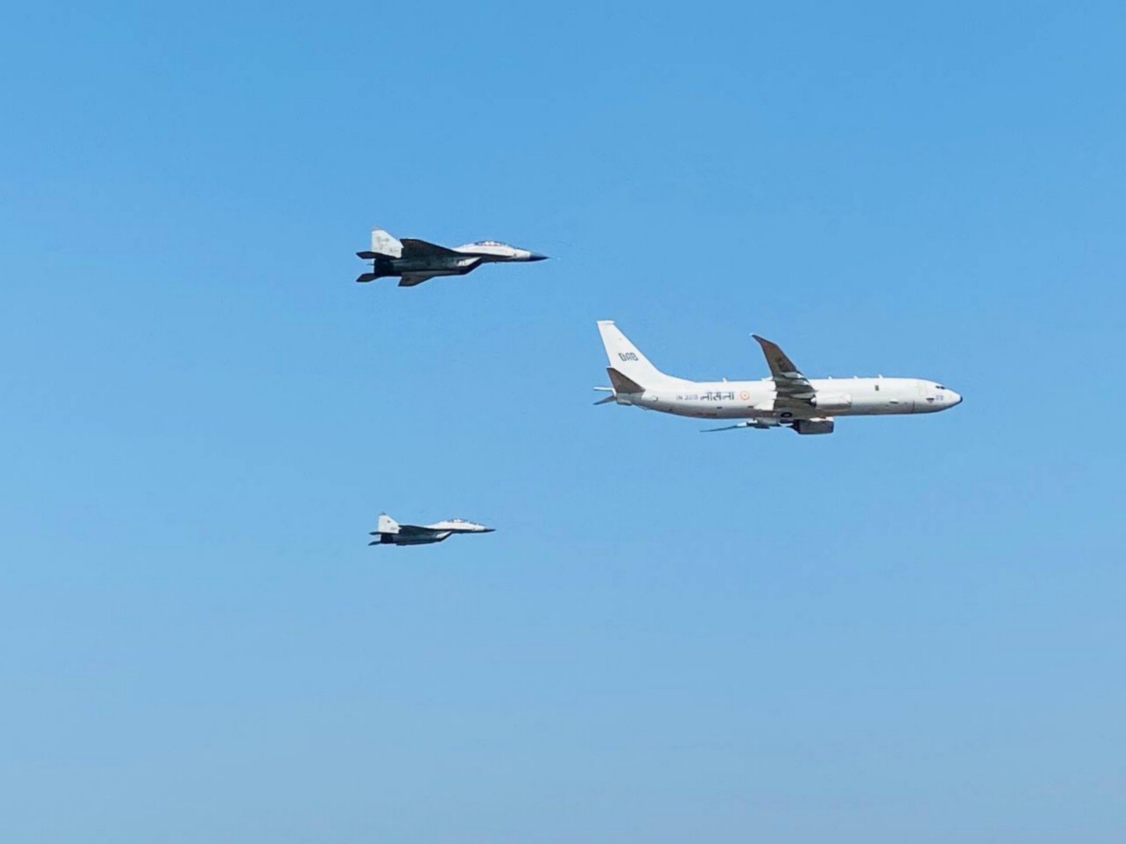 Indian Navy P-8I Poseidon aircraft in formation with MiG-29K fighter jets