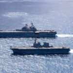 USS Tripoli conducting a group sail during Exercise Iron Fist