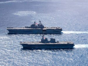 USS Tripoli conducting a group sail during Exercise Iron Fist