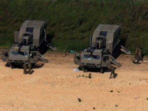 Israeli soldiers stand near the Israel-Lebanon border