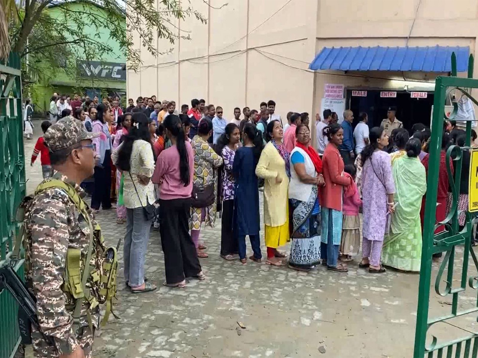 Voters line up at a polling booth in Dibrugarh